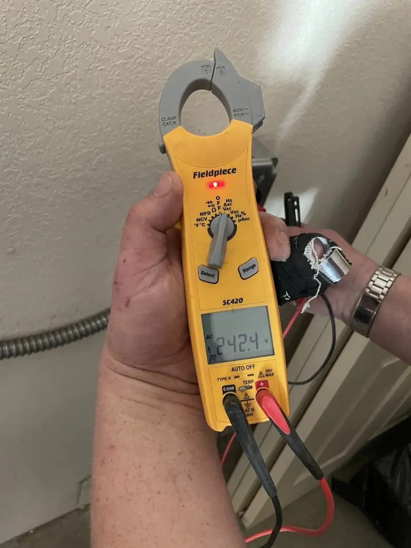 Voltage testing with clamp meter during Outlet Installation in Fort Lee